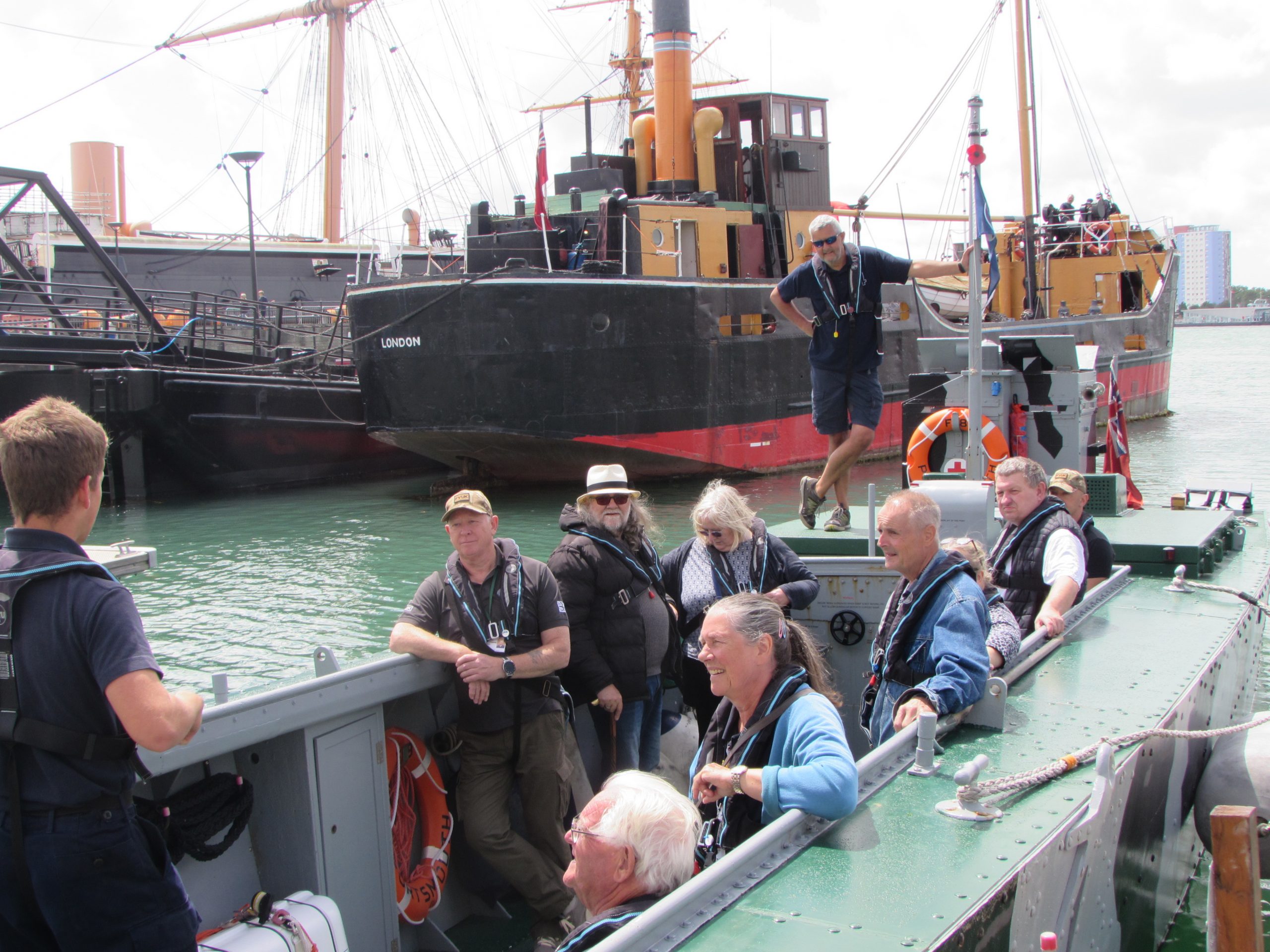 A group of people on a small landing craft vessel | VOS