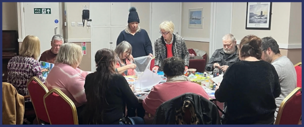 Local veterans and spouses do an art journaling workshop for wellbeing and mental health at the Royal Maritime Club in Portsmouth.