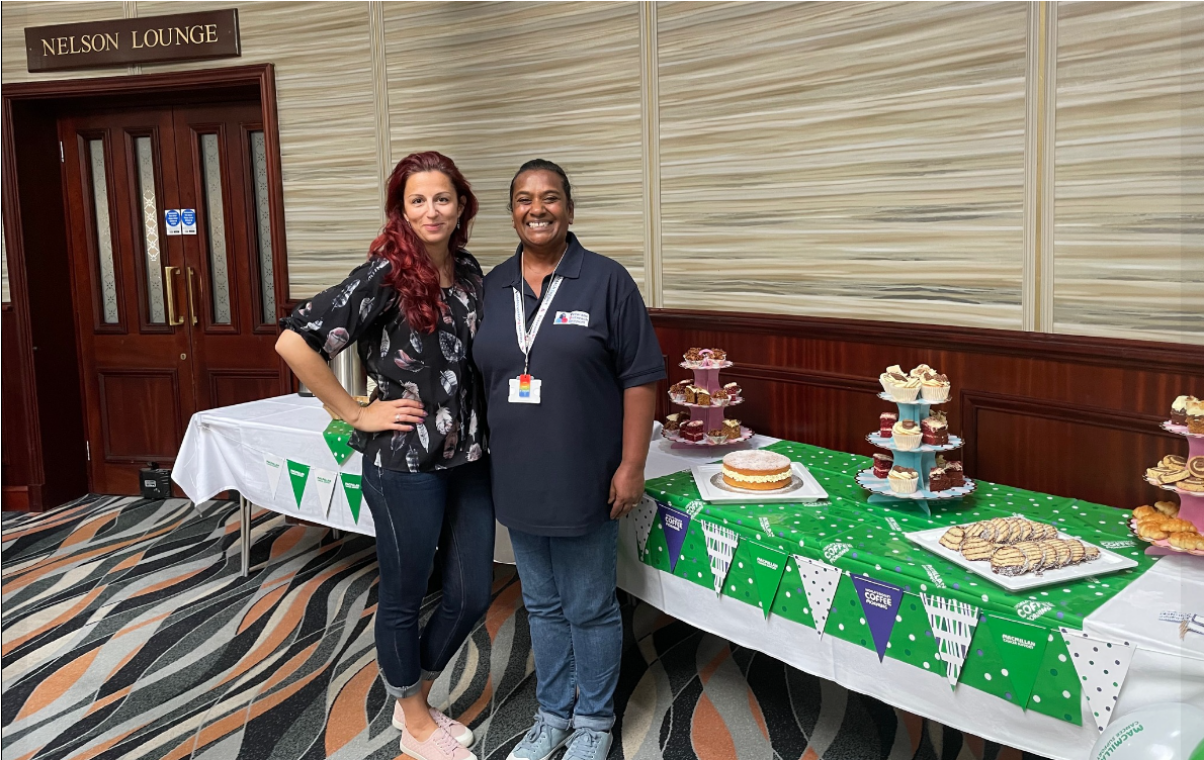 VOS Clinical Manager Sharon (right) welcomes guests to a MacMillan Coffee Morning at the RMH.