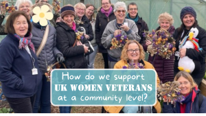 Group of women veterans standing in a group showing flower arrangements they have created